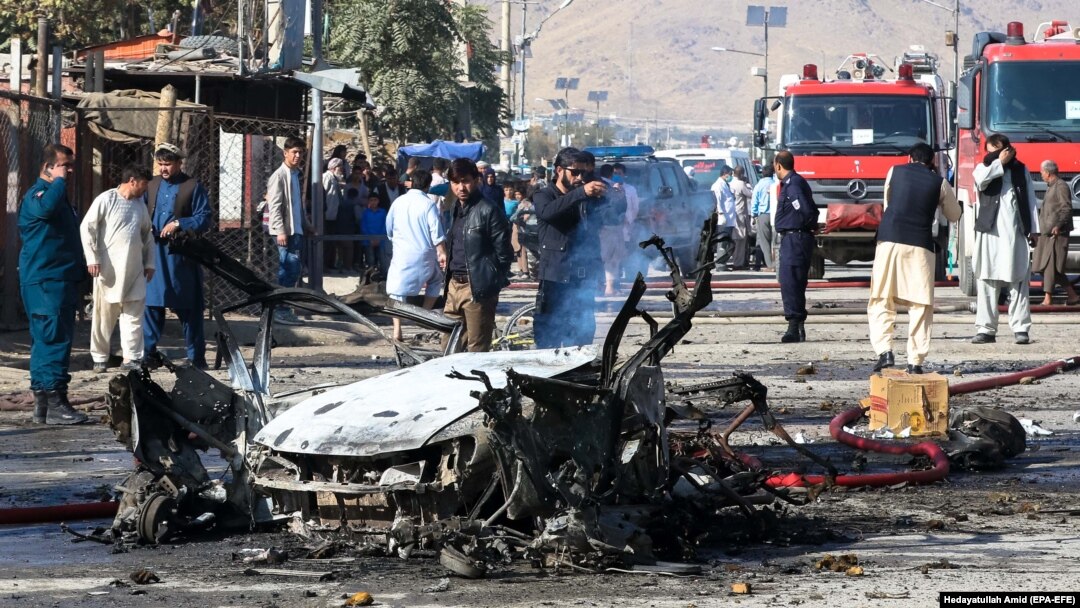Afghan security forces inspect the site of a blast in Kabul on October 27.