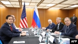 Russia's Foreign Minister Sergey Lavrov (front right) attends a meeting with US Secretary of State Marco Rubio (front left) on July 23. 