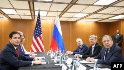 Russia's Foreign Minister Sergey Lavrov (front right) attends a meeting with US Secretary of State Marco Rubio (front left) on July 23. 