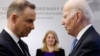 Poland's President Andrzej Duda (left) greets U.S. President Joe Biden next to Slovakia's then-President Zuzana Caputova in Warsaw in February 2023.