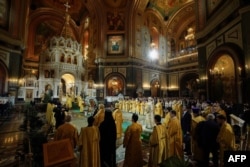 In this handout photograph released by the Russian Orthodox Church Press Service, Patriarch Kirill leads a Christmas mass at the Christ the Savior Cathedral in Moscow.