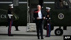 US President Donald Trump steps off Marine One after landing at Ocala International Airport in Florida, where he spoke at The Villages retirement community on May 1.