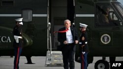 US President Donald Trump steps off Marine One after landing at Ocala International Airport in Florida, where he spoke at The Villages retirement community on May 1.