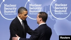 U.S. President Barack Obama (left) greets his Russian counterpart Dmitry Medvedev at the Nuclear Security Summit in Washington on April 12.