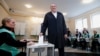 Georgian President Georgy Margvelashvili casts his ballot during the second round of parliamentary elections in Tbilisi on October 30.