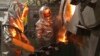 Workers pour molten gold from a crucible into moulds in a workshop at Kyrgyzstan's Kumtor gold mine. (file photo)