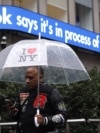 A man walks past an information display in New York City following TikTok's announcement on January 19 that it was restoring its service in the United States. 