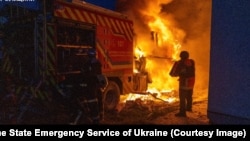 A Ukrainian firefighter attempts to extinguish a blaze that destroyed a fire truck on November 24.<br><br>Ukraine's State Emergency Service claimed the vehicle was struck by a Russian drone as firefighters were responding to the aftermath of a strike on the northeastern city of Sumy.