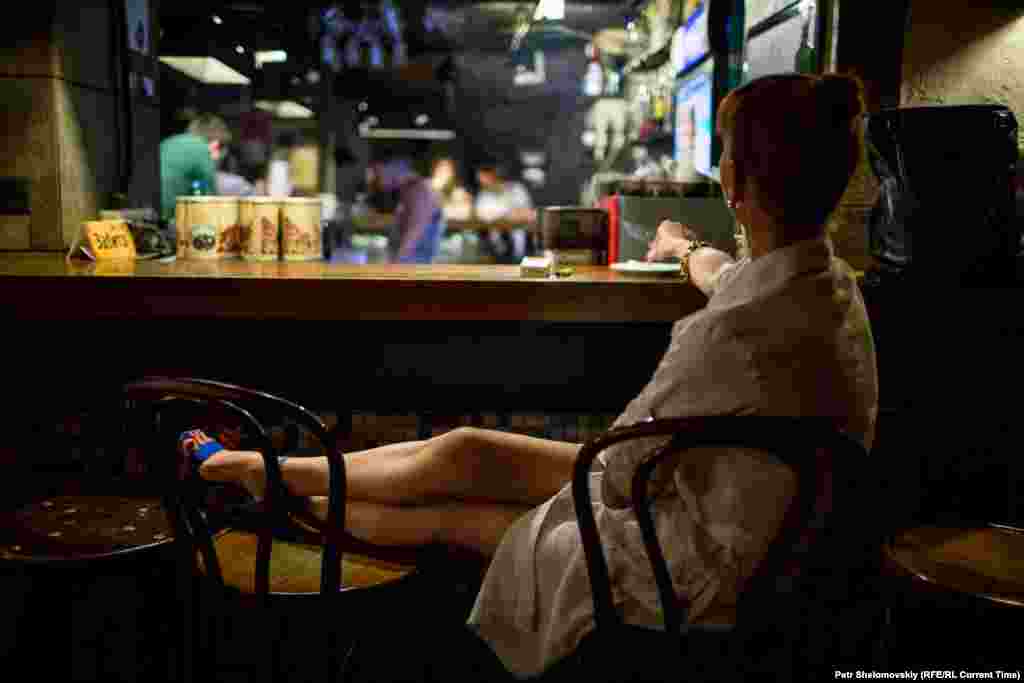 Waiting for a taxi. It is difficult to get a cab after the curfew starts, as few drivers are prepared to risk night time Donetsk for a few small fares.