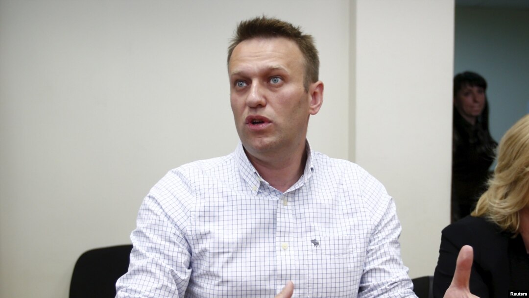 Russian opposition leader Aleksei Navalny talks to the media before a hearing at the Lublinsky district court in Moscow on May 13.