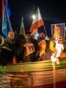 Demonstrators hold pre-1979 Islamic Revolution Iranian flags and placards during a protest march in solidarity with Iran, in Amsterdam, on January 14, 2026.