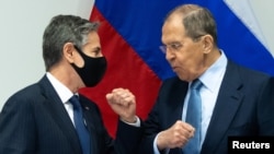 Antony Blinken (left) greets Sergei Lavrov at a meeting in Reykjavik in May.