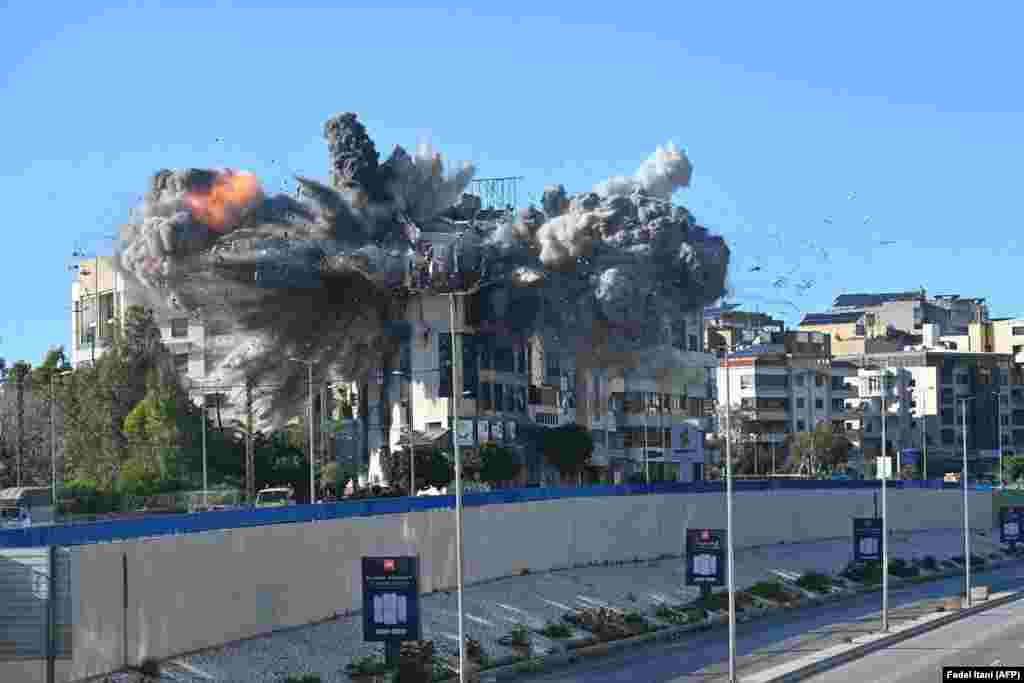 A strike shatters a building near Beirut's airport on March 31 after the Israeli military warned it would hit a "Hezbollah facility" in Lebanon.In parallel with the war with Iran, conflict between Israel and Iranian-backed Hezbollah militants has escalated sharply in recent weeks.