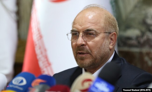 Parliament speaker Mohammad Baqer Qalibaf speaks during a press conference in Damascus in July 2021.