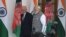 Indian Prime Minister Narendra Modi (R) and Afghan President Mohammad Ashraf Ghani walk together before a meeting in New Delhi on October 24.