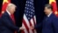 US President Donald Trump and Chinese leader Xi Jinping greet each other as they arrive for talks in Busan on October 30.