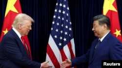 Američki predsjednik Donald Trump i kineski lider Xi Jinping po dolasku na razgovore u Busanu, 30. oktobra 2025.