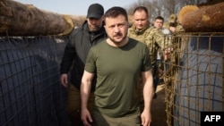 This photograph taken and released by the Ukrainian Presidential Press Service on April 9 shows Ukraine's President Volodymyr Zelenskiy visiting the construction site of a defense line in the Kharkiv region.