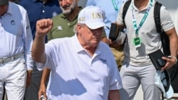 US President Donald Trump, shown at a golf tournament in New Jersey, told Axios that 'we are low-keying it" in talks with Iran.