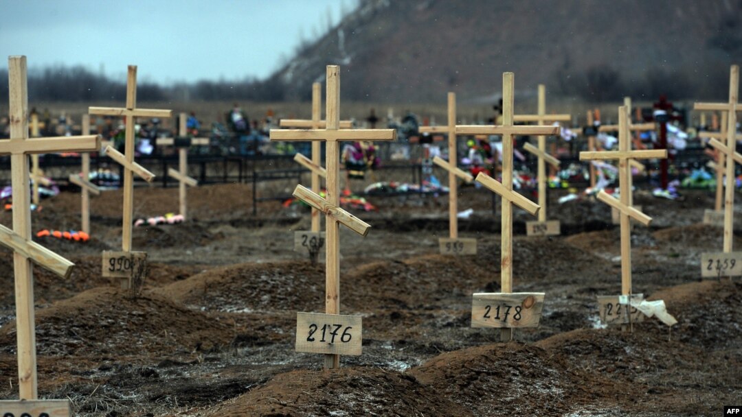 Crosses marked only with numbers stand on the graves of unknown pro-Russian separatists at a cemetery in the eastern Ukrainian city of Donetsk in February.