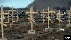 Crosses marked only with numbers stand on the graves of unknown pro-Russian separatists at a cemetery in the eastern Ukrainian city of Donetsk in February.