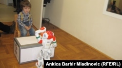 Four-year old Croatian boy Luka (left), who has autism spectrum has developed an unusual friendship with a robot called Rene. 