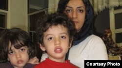 Iranian human rights activist, Narges Mohammadi, (right) with her children, Ali (center) and Kiana. 