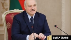 Alyaksandr Lukashenka attends a meeting with governors of Russia's Leningrad and Irkutsk regions in Minsk on September 25.