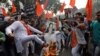 Activists from a right-wing Hindu group burn an effigy of Pakistani Prime Minister Imran Khan at a protest against a bus attack that killed 44 police in south Kashmir on February 14.