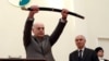 Aslan Bzhania holds a sword during his inauguration ceremony in Sukhumi on April 23.