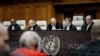President of the International Court of Justice (ICJ) US lawyer Joan Donoghue (2R) confers with colleagues at the court in The Hague on January 12, 2024, prior to the hearing of the genocide case against Israel, brought by South Africa.