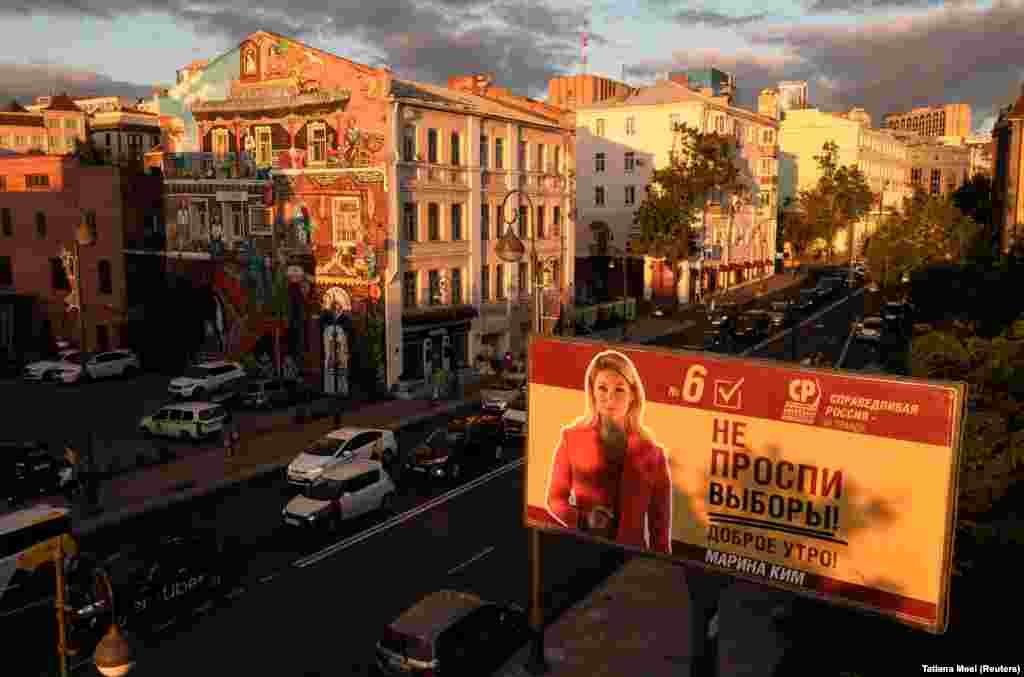 A campaign poster for the A Just Russia -- For Truth party candidate for the upcoming&nbsp; parliamentary elections is seen at sunset in Vladivostok, Russia.