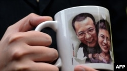 A mug bearing a picture of mainland jailed dissident Liu Xiaobao and his wife Liu Xia, who is currently under house arrest.