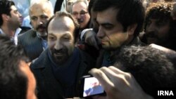 Director Asghar Farhadi (center) was mobbed by fans on his arrival at Tehran's airport in early March, two weeks after his Oscar victory.