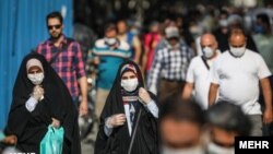 People wearing masks on the streets of the Iranian capital Tehran. 