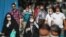 People wearing masks on the streets of the Iranian capital Tehran. 
