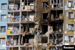 A damaged multistory residential building following a Ukrainian drone attack in a Moscow region town in September 2024