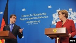 Russian President Dmitry Medvedev and German Chancellor Angela Merkel give a press conference after the plenary session of the German-Russian government talks in Yekaterinburg on July 15.