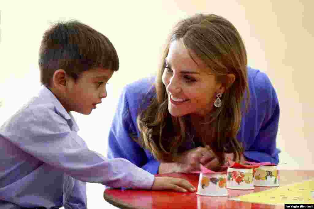 The duchess connects with a schoolboy in Islamabad.