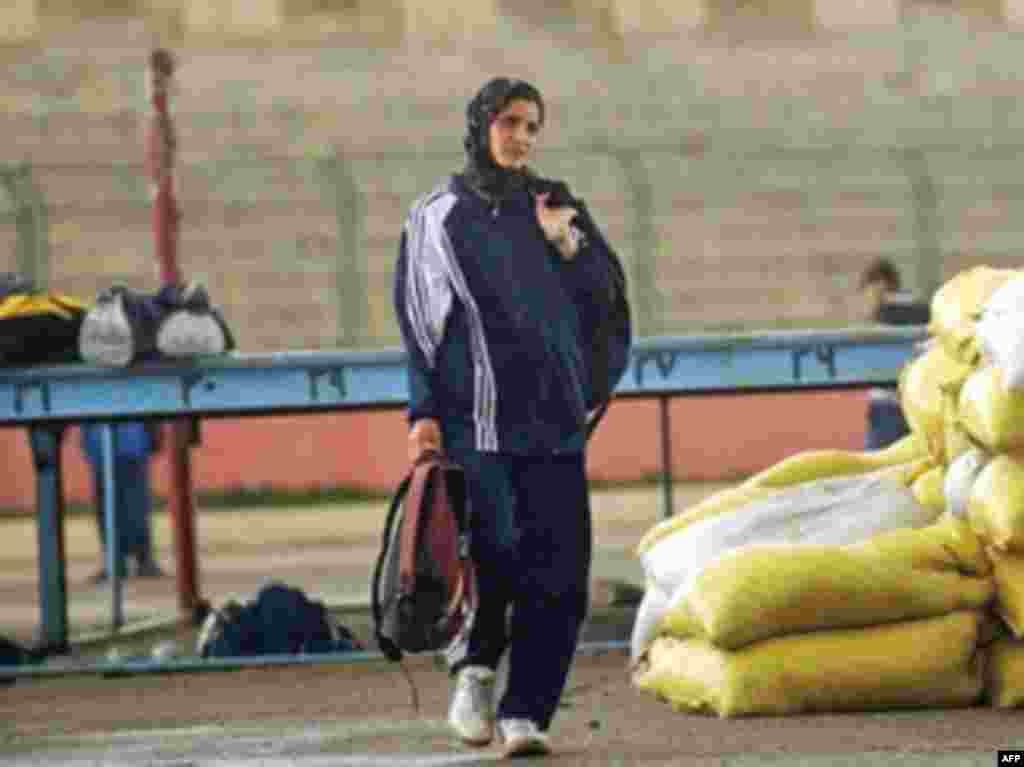 Afghan distance runner Mahbooba Ahadyar trains at Kabul Olympic Stadium in March 2008, one of only three athletes to compete for the country in the Beijing Games that year.