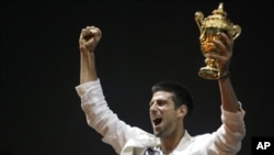 Novak Djokovic lifts the WImbledon men's singles trophy in Belgrade in July.