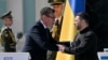 Britain's Prime Minister Andy Burnham shakes hands with Ukraine's President Volodymyr Zelenskyy during a commemorative ceremony marking Ukraine's 35th Independence Day outside St. Sofia cathedral in Kyiv on August 24, 2026.
