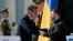 Britain's Prime Minister Andy Burnham shakes hands with Ukraine's President Volodymyr Zelenskyy during a commemorative ceremony marking Ukraine's 35th Independence Day outside St. Sofia cathedral in Kyiv on August 24, 2026.