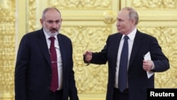 RUSSIA - Armenian Prime Minister Nikol Pashinian and Russian President Vladimir Putin speak during a Commonwealth of Independent States summit at the Kremlin in Moscow, October 8, 2024.