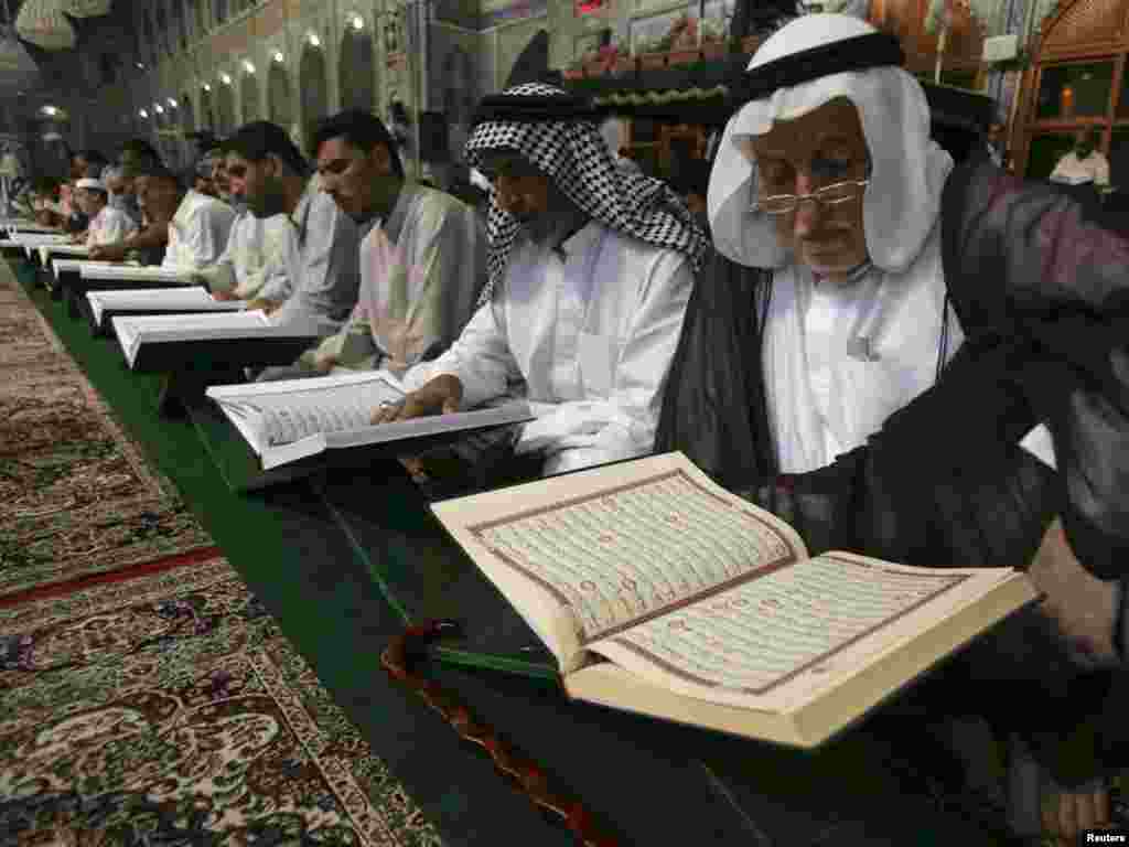 Muslim men read the Koran during the holy month of Ramadan at the Imam Husayn Shrine in Karbala, south of Baghdad, on August 18. Muslims around the world abstain from eating, drinking, and sexual relations from sunrise to sunset during Ramadan, the holiest month in the Islamic calendar.Photo by Mushtaq Muhammad for Reuters