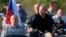 Russian President Vladimir Putin drives a motorcycle during a bike show outside Sevastopol, Crimea, on August 10.