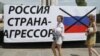 A sign is seen in Mariupol on the occasion of the fourth anniversary of the city's liberation from pro-Russia forces on June 16.