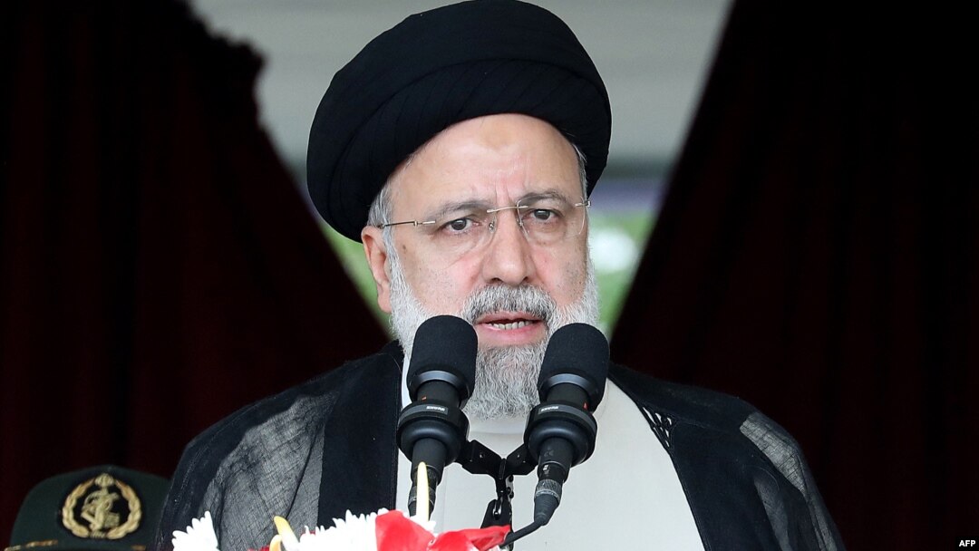 Iranian President Ebrahim Raisi attends a military parade alongside high-ranking officials and commanders during a ceremony marking the country's annual National Army Day in Tehran on April 17. 