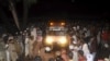 Supporters of Malik Ishaq, chief of the Al-Qaeda-linked Laskhar-e-Jhangvi in the Punjab region, wait for the arrival of his body for burial before his funeral in Rahimyarkhan in southern Punjab Province on July 29.