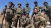 Afghan soldiers pose for a group photo during a patrol in Helmand province on February 14.